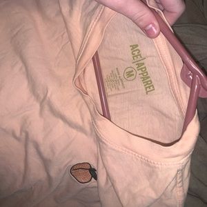 An ace apparel peach shirt